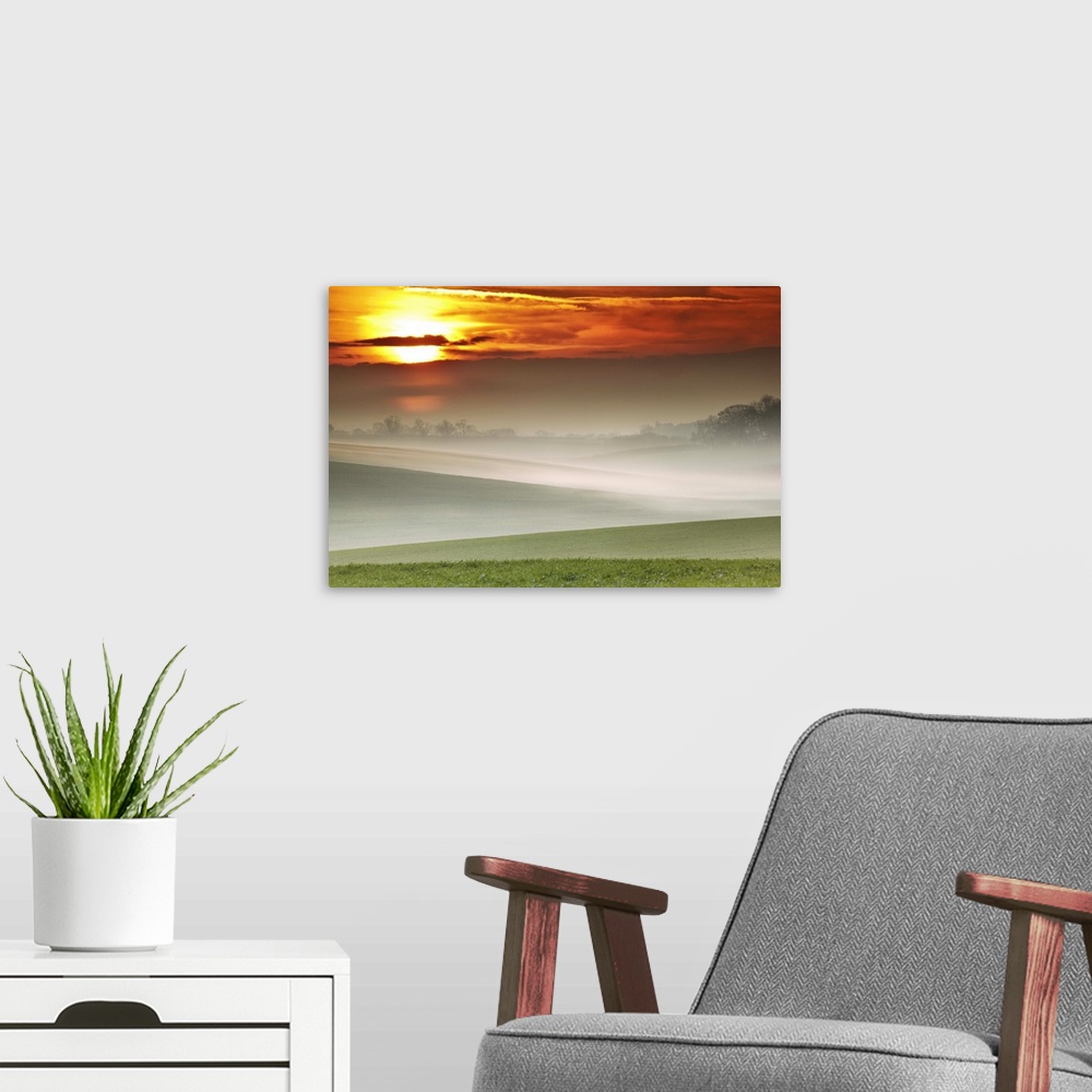 A modern room featuring Mist over landscape of rolling hills at sunset, Exton, Rutland.