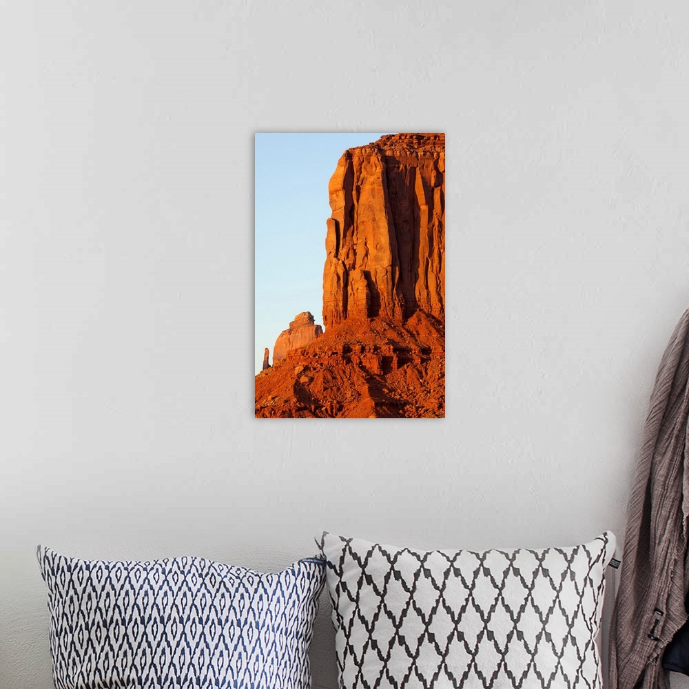 A bohemian room featuring Setting sun lights red sandstone rock cliffs of The Mittens in Monument Valley. | Location: Monum...