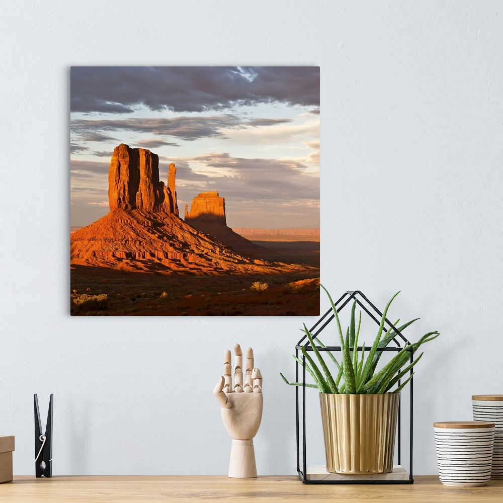 A bohemian room featuring Mittens of Monument Valley at sunset, US.