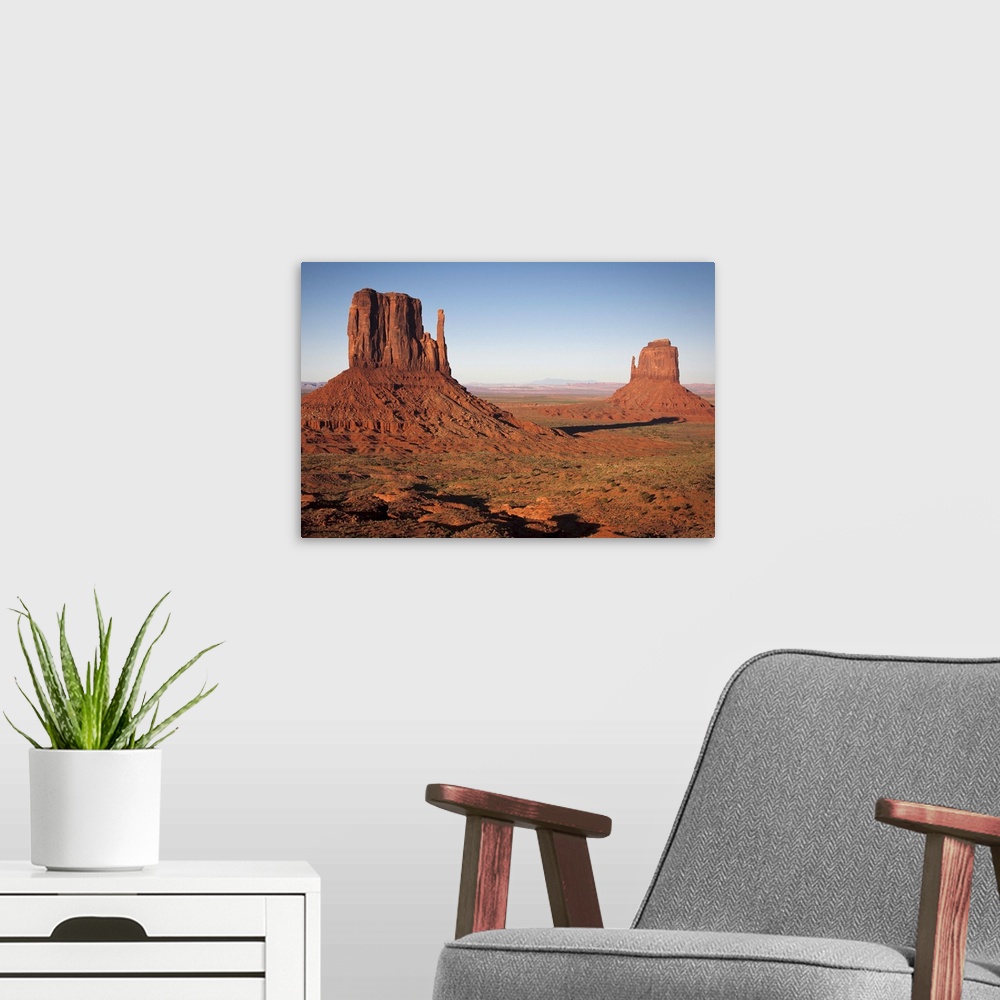 A modern room featuring Monument Valley at sunset, Utah, United States of America.