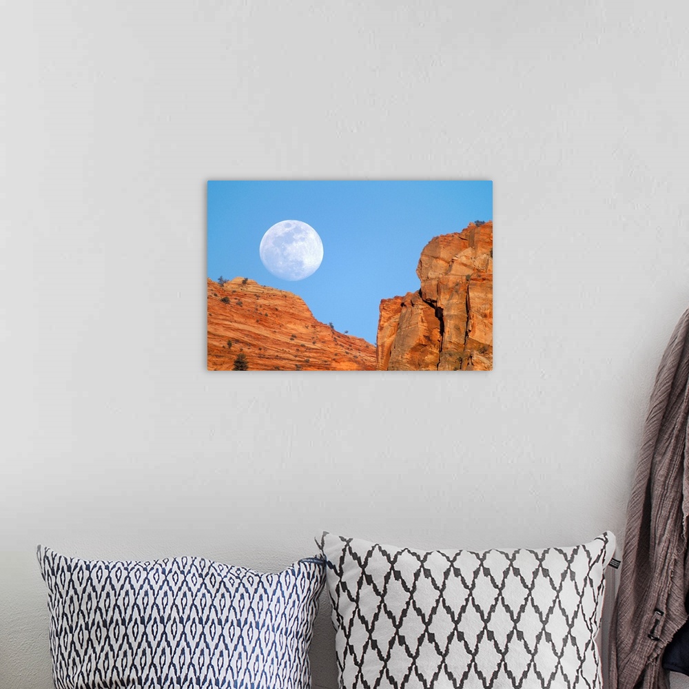 A bohemian room featuring Moonrise over cliffs of Zion Canyon.