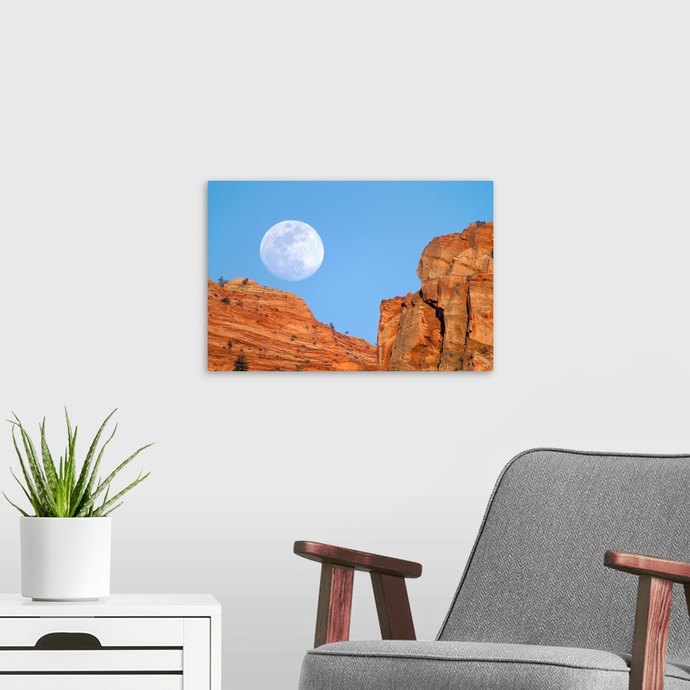 A modern room featuring Moonrise over cliffs of Zion Canyon.