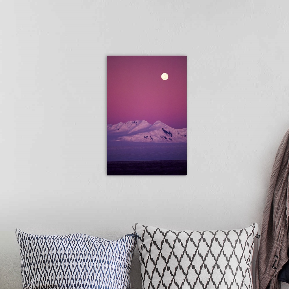 A bohemian room featuring Moonrise over snowy mountain