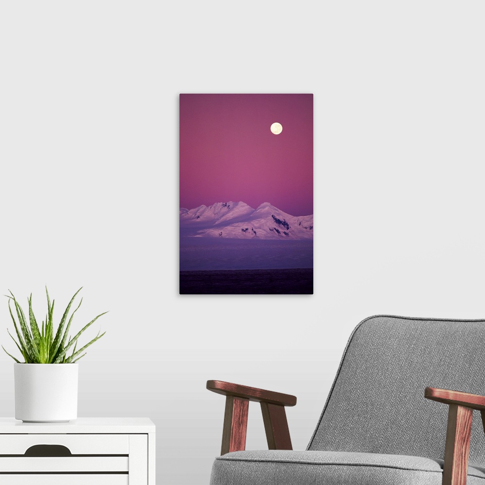 A modern room featuring Moonrise over snowy mountain