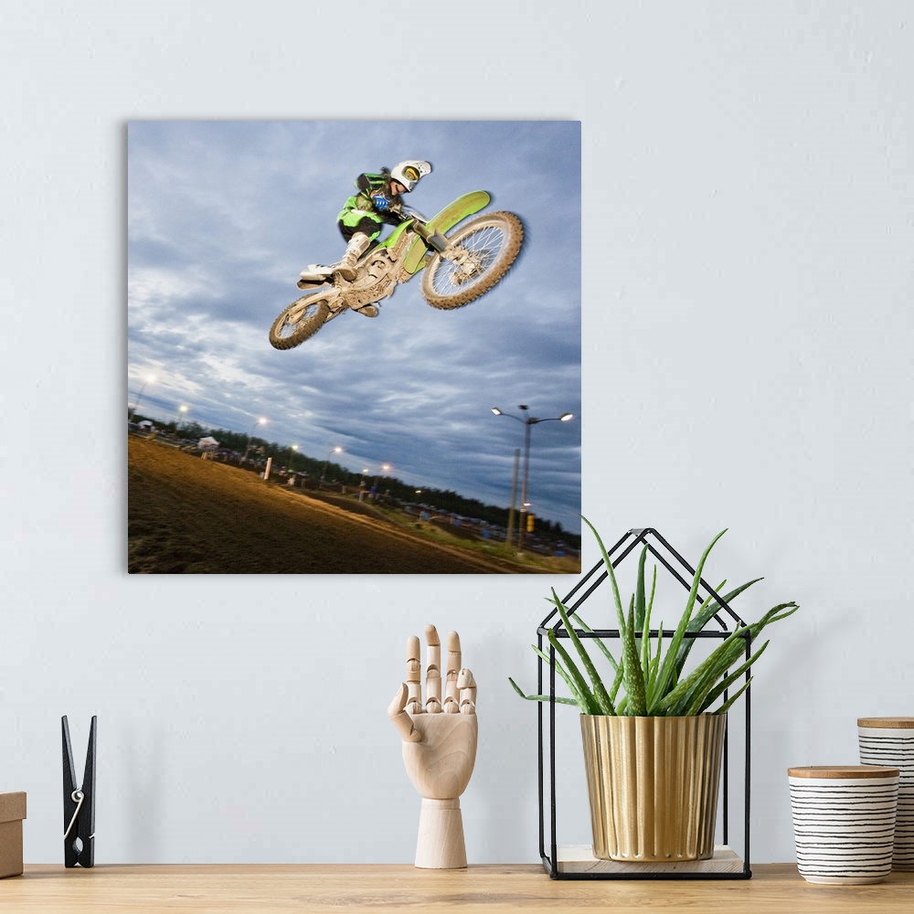 A bohemian room featuring Motorcross rider jumping on track
