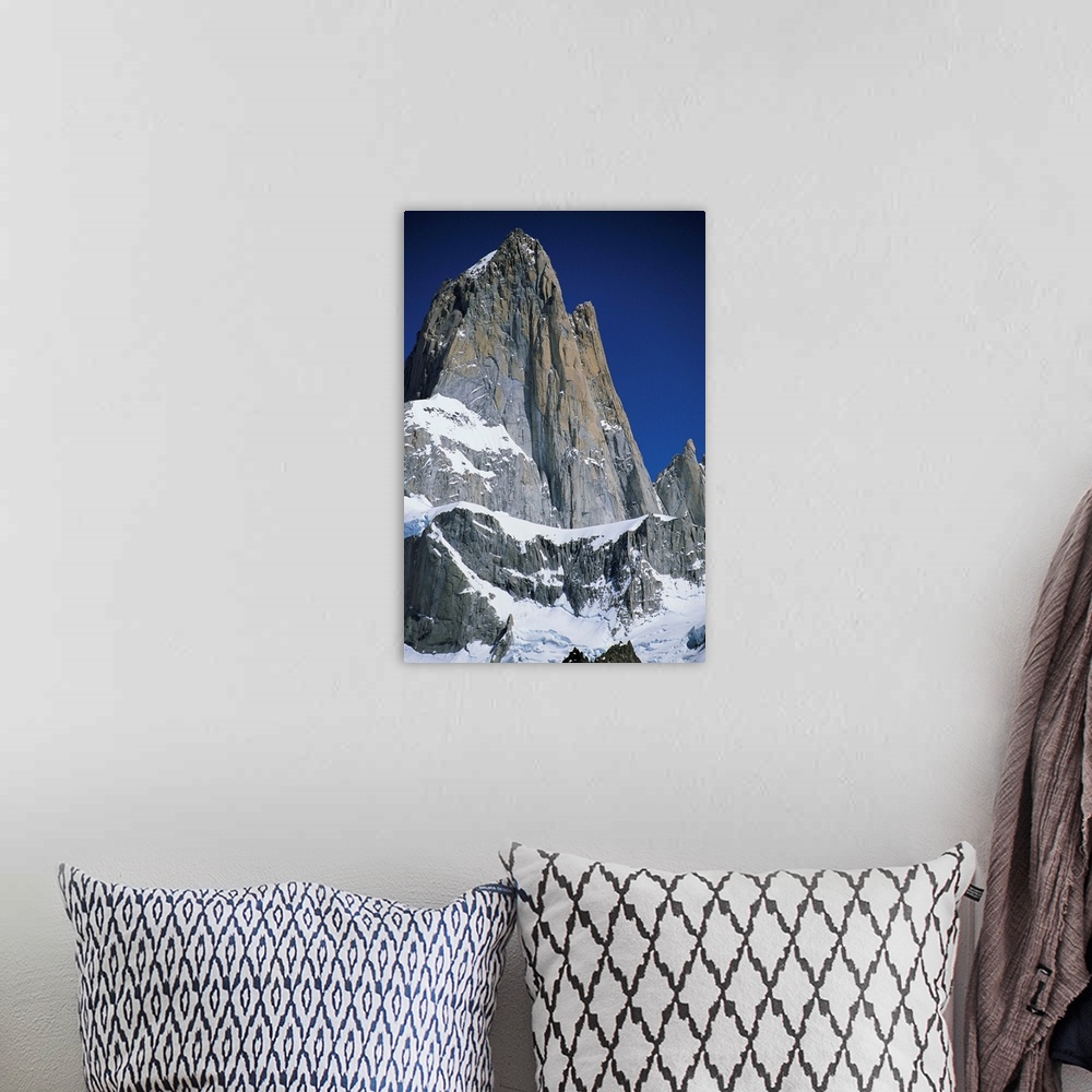 A bohemian room featuring The peaks of Mount Fitz Roy in the Patagonian Andes.