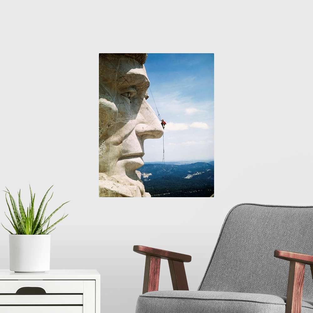 A modern room featuring Tourists Never See Mount Rushmore from the Top. Looking more like a pesky fly than a repairman, M...