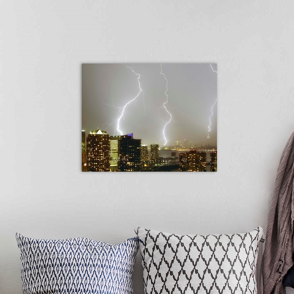 A bohemian room featuring Multiple dramatic lightning strikes viewed from Jersey City, New Jersey looking towards New York ...
