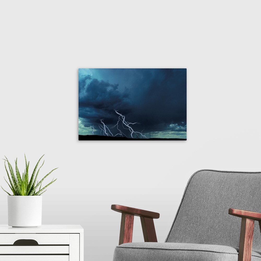 A modern room featuring Multiple lightning bolts over rural landscape