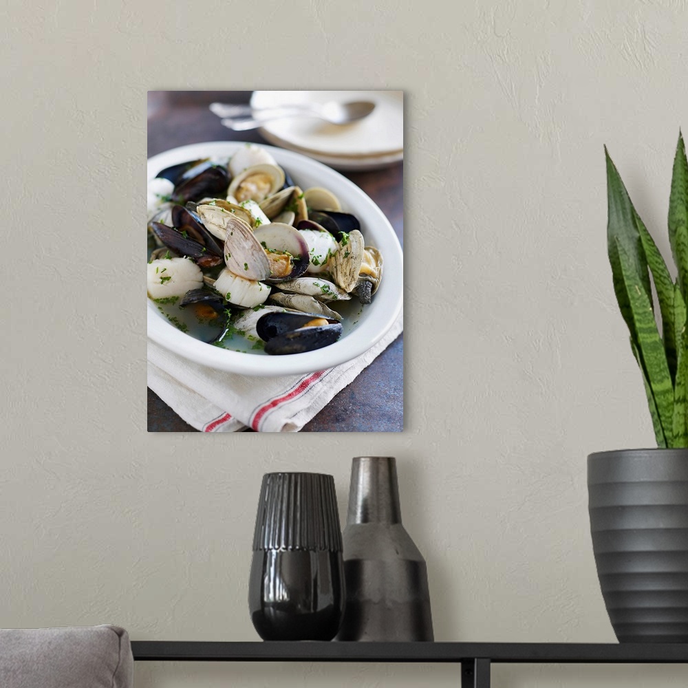 A modern room featuring Mussels, scallops, clams in broth