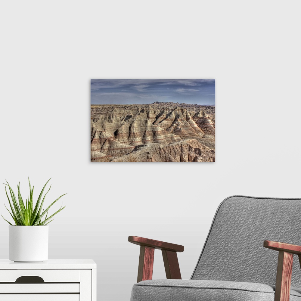 A modern room featuring Natural formations in Badlands of South Dakota, showing striations and contours.Hills show erosio...