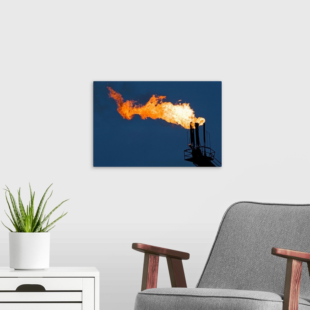 A modern room featuring Natural gas flare from an offshore oil rig in Cook Inlet, Alaska.