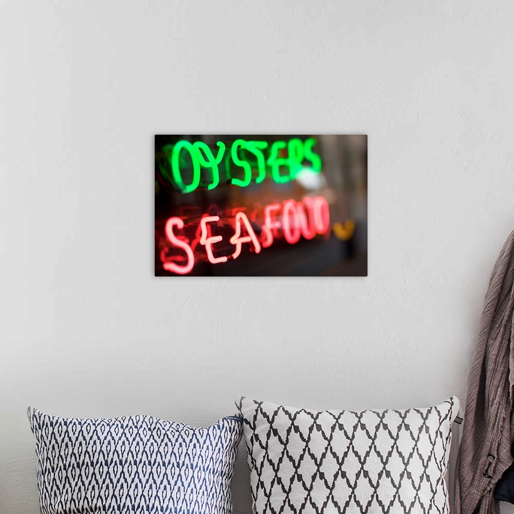 A bohemian room featuring Neon oysters and seafood sign