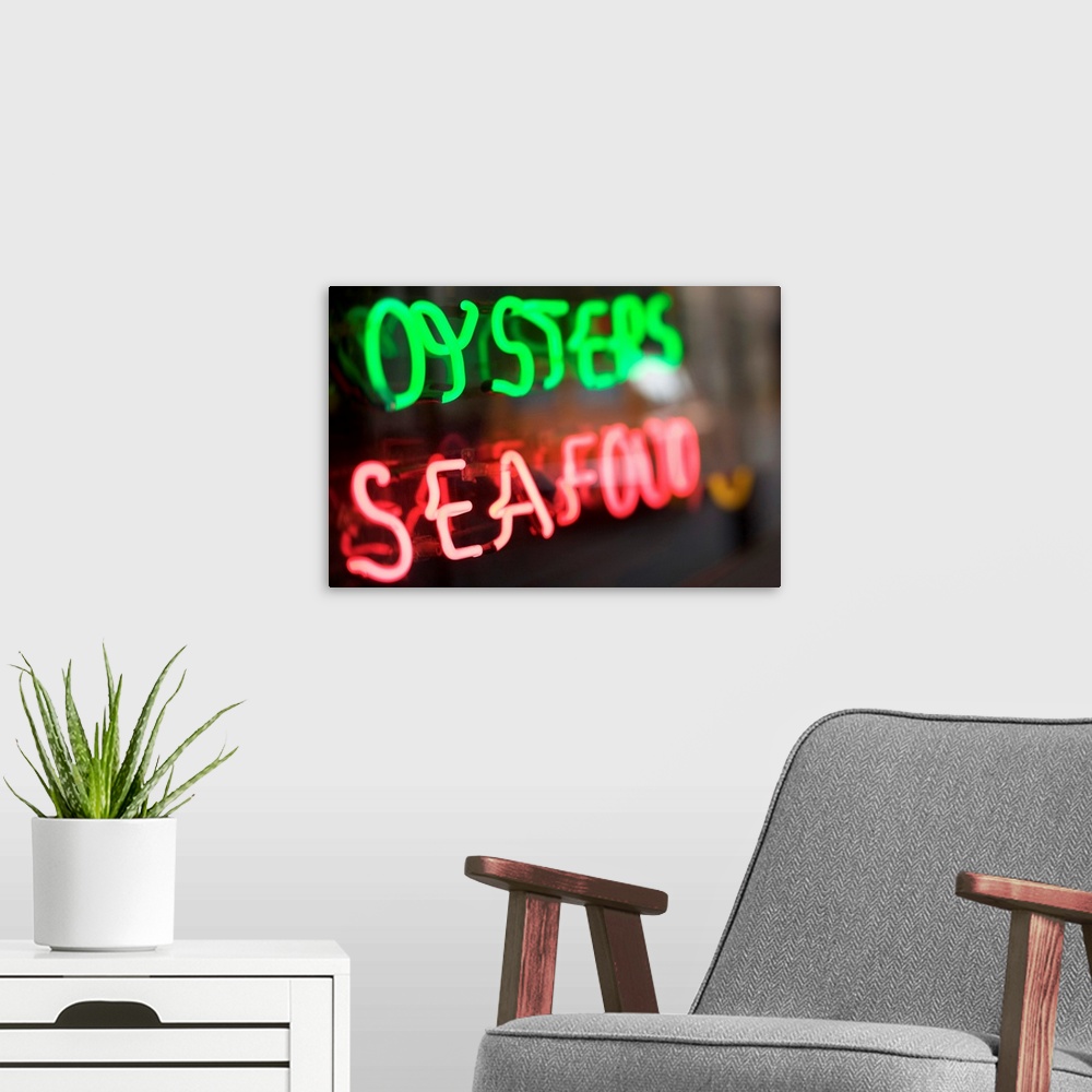 A modern room featuring Neon oysters and seafood sign