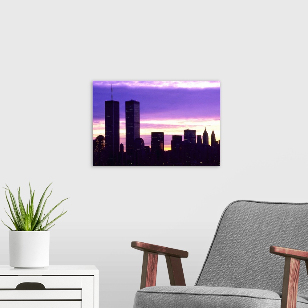 A modern room featuring New York City at dusk