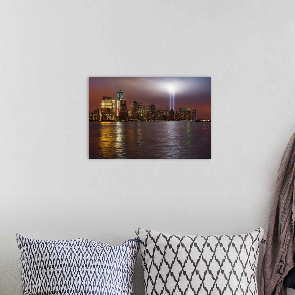 A bohemian room featuring Large, horizontal photograph of New York City, the Manhattan skyline at night, with 9/11 memorial...