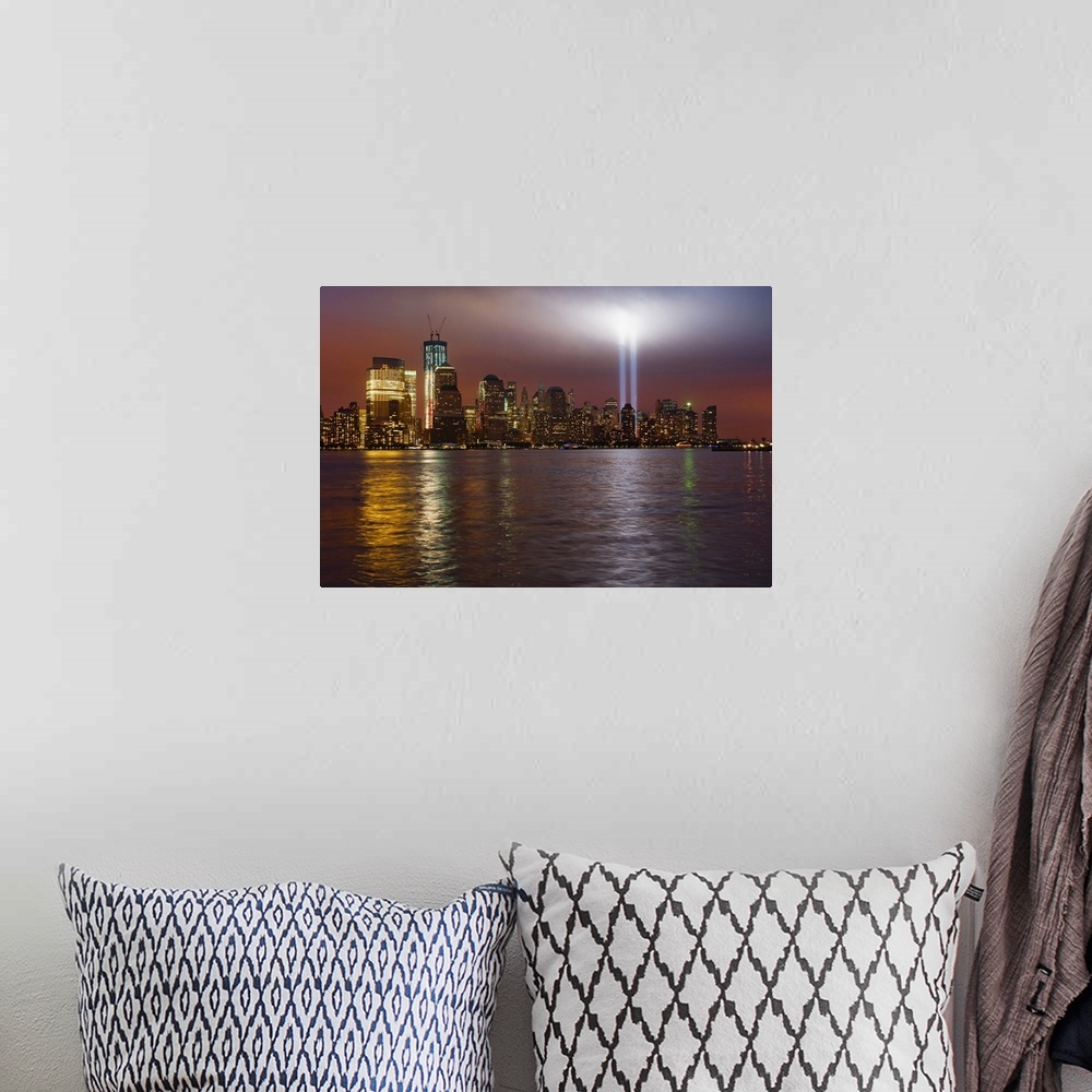 A bohemian room featuring Large, horizontal photograph of New York City, the Manhattan skyline at night, with 9/11 memorial...