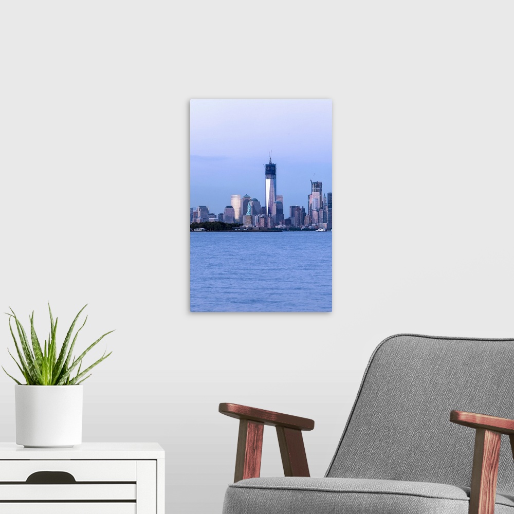 A modern room featuring New York City skyline with the new World Trade Center under construction.