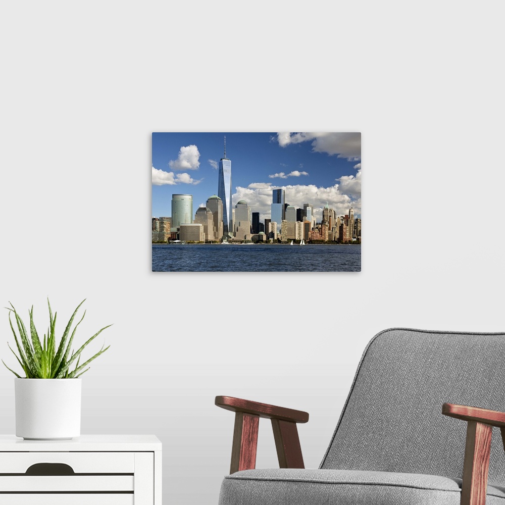 A modern room featuring The Financial District viewed over the Hudson River towards Manhattan