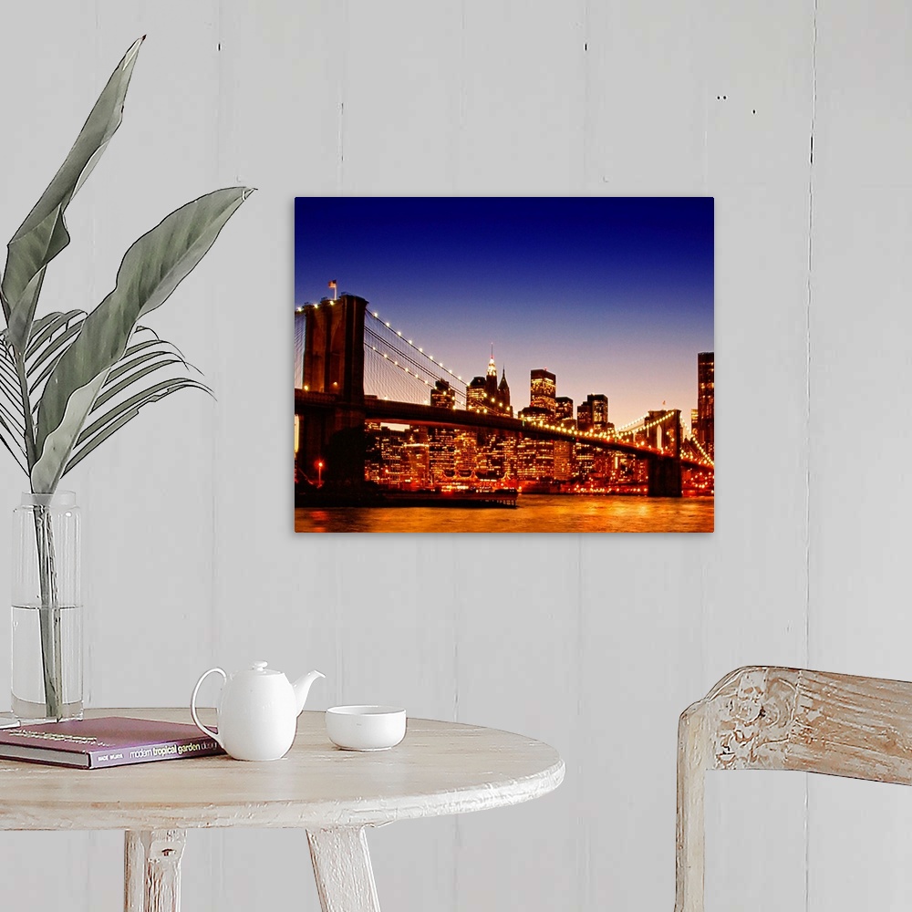 A farmhouse room featuring Large photograph of the Brooklyn bridge with a sun kissed river below at dusk with NYC lit up in ...