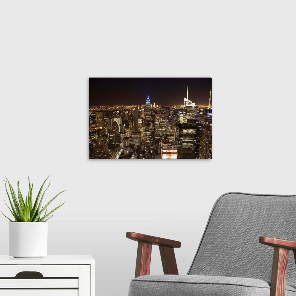 A modern room featuring USA, New York, View of skyline by night