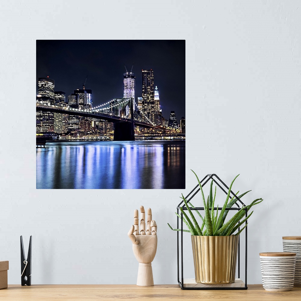 A bohemian room featuring View of New York's Brooklyn bridge reflection in water.