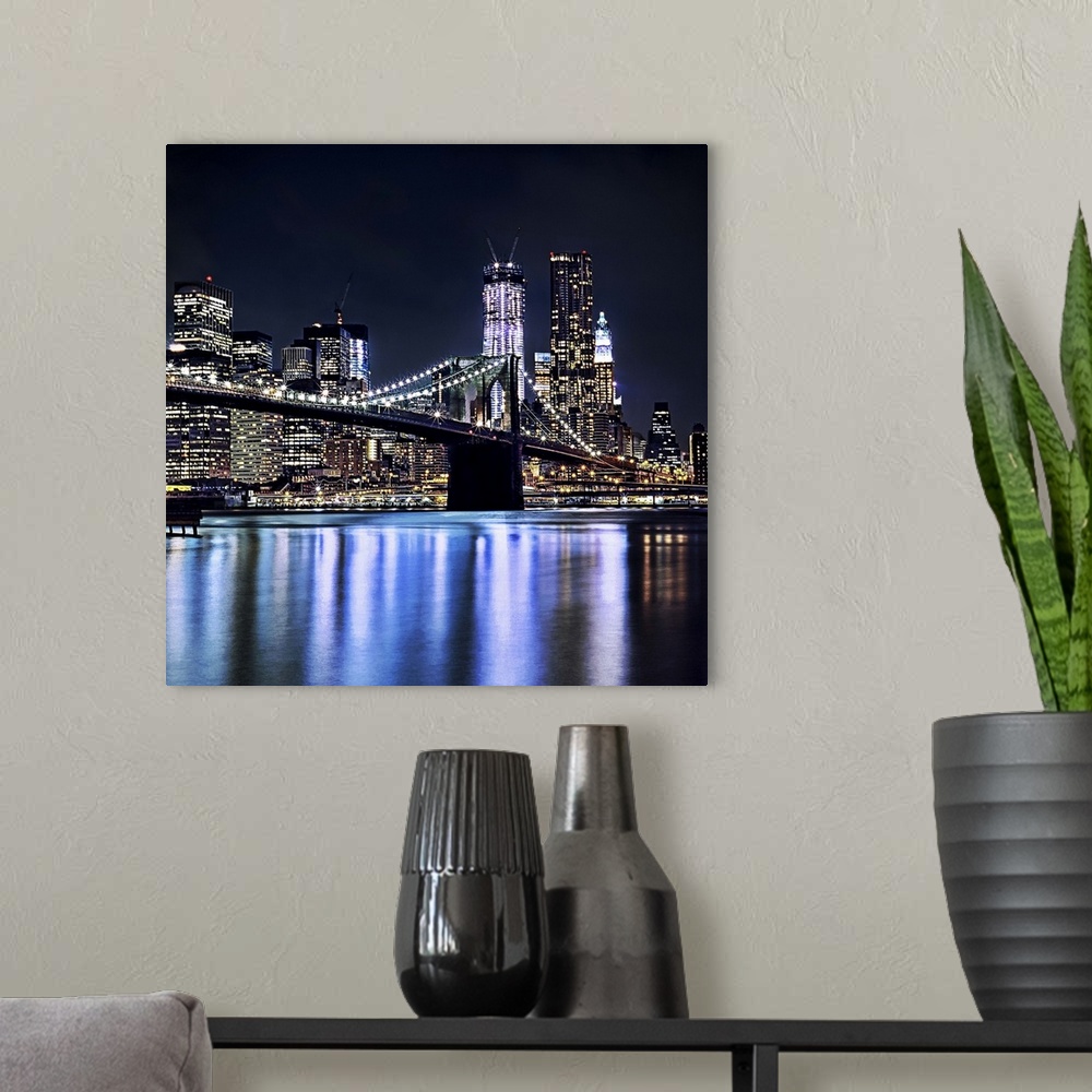 A modern room featuring View of New York's Brooklyn bridge reflection in water.