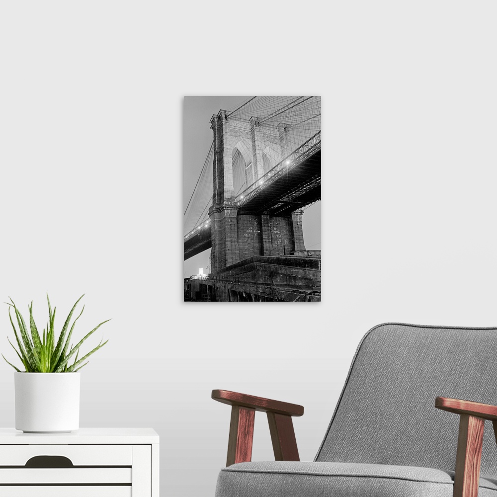 A modern room featuring New York City: (Undated) Brooklyn Bridge spans the East River. Photo shows the pillar on the Manh...
