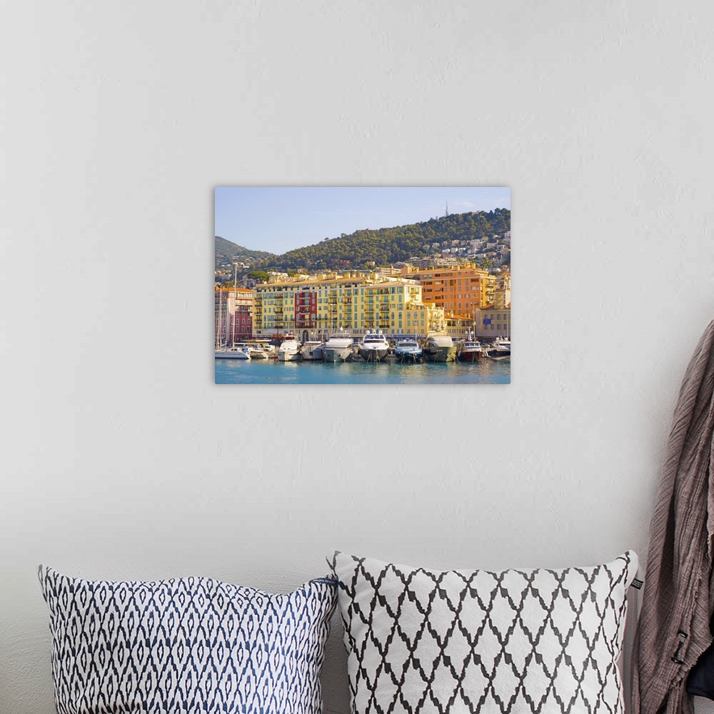 A bohemian room featuring Nice Harbour, Cote d'Azur with ship and building in France.