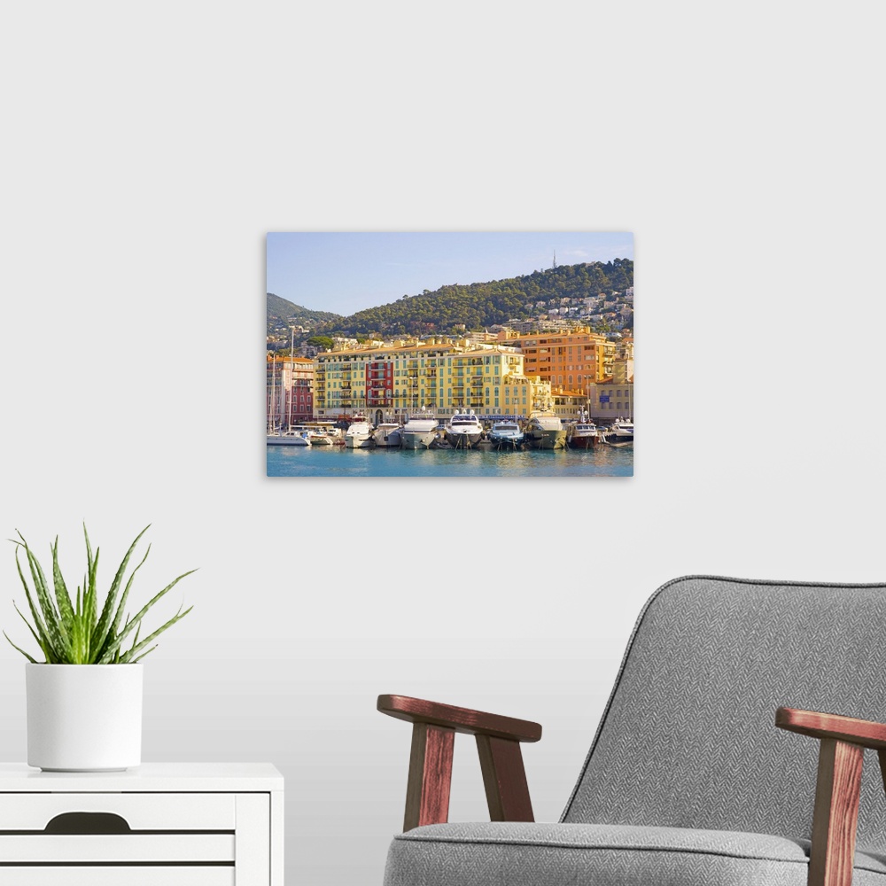 A modern room featuring Nice Harbour, Cote d'Azur with ship and building in France.