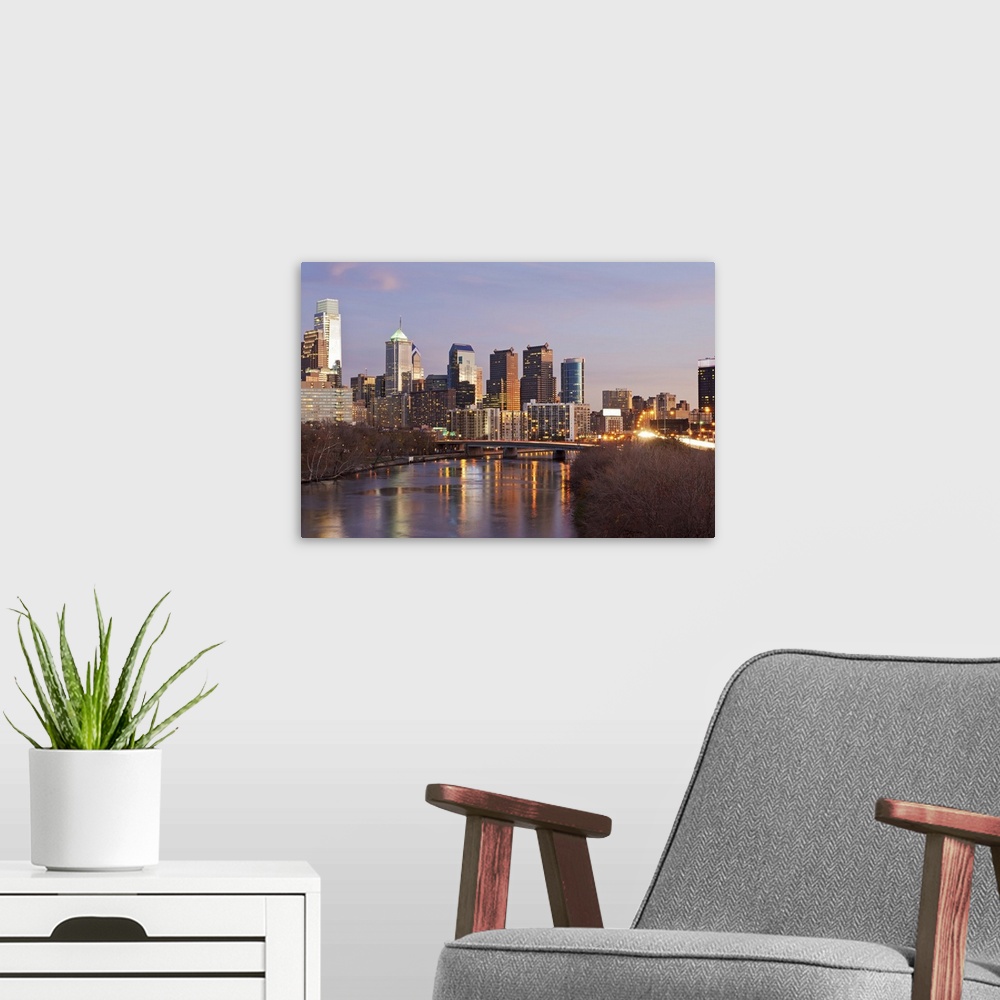 A modern room featuring Night time panoramic view at Philadelphia downtown landmark skyscrapers with reflections in Schuy...