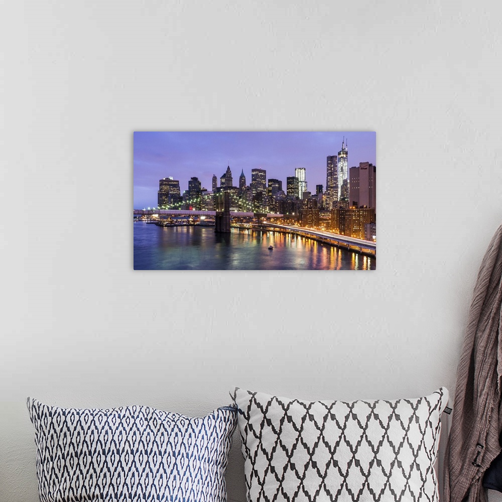 A bohemian room featuring Blue hour view of Brooklyn Bridge and Lower Manhattan as seen from the Manhattan Bridge. A touch ...