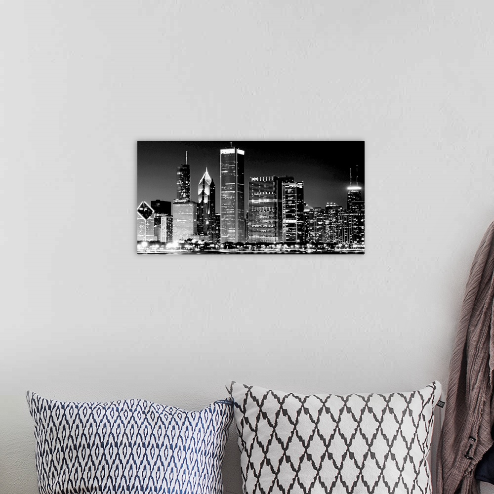 A bohemian room featuring This high contrast landscape photograph shows the illuminated nightscape of this city skyline.