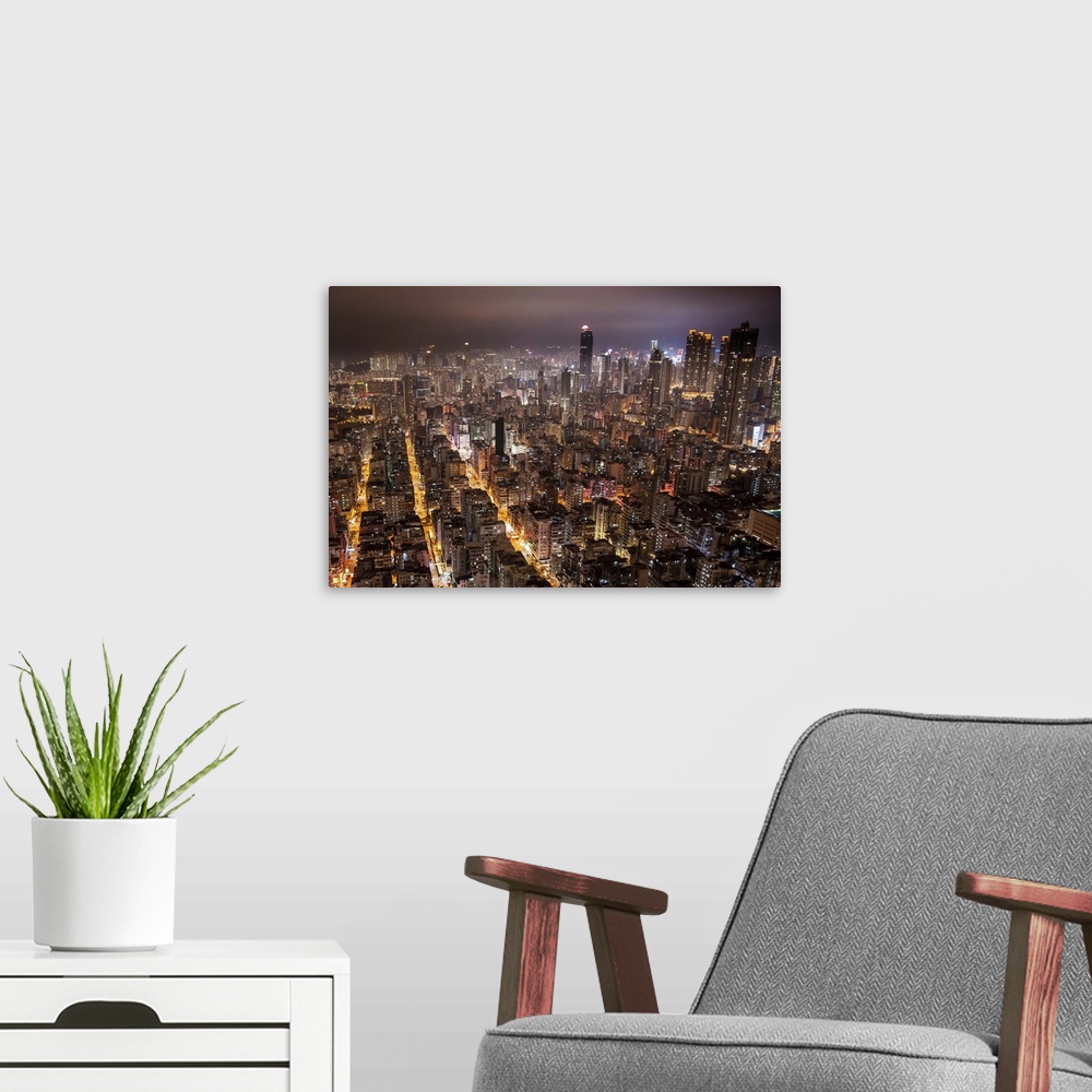 A modern room featuring Night view of Kowloon, Hong Kong.