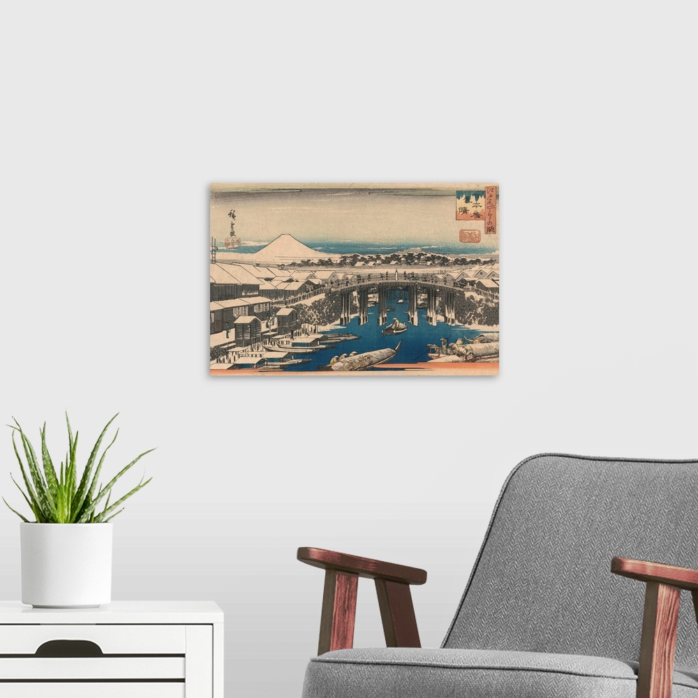 A modern room featuring A print from the series Three Famous Evening Views of Edo by Hiroshige.