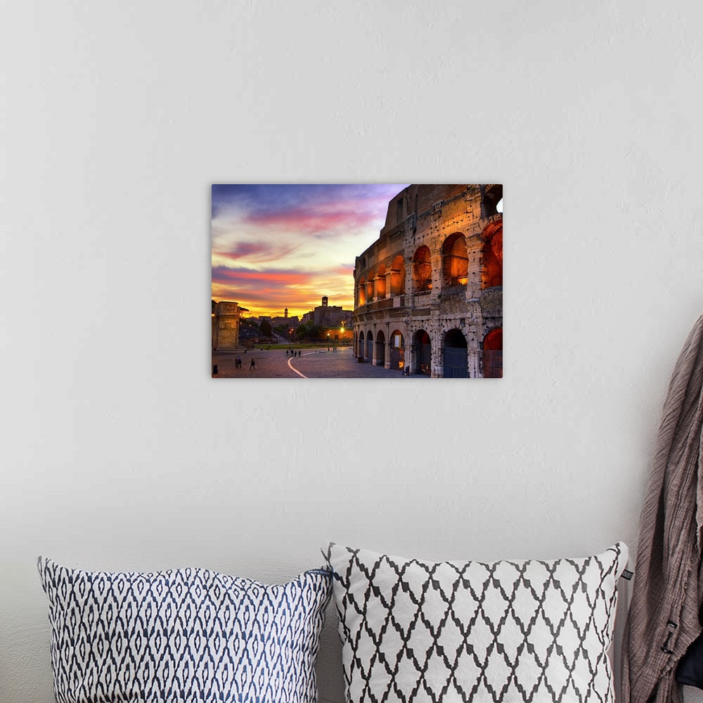A bohemian room featuring Photograph of the Colosseum in Rome, Italy at sundown.