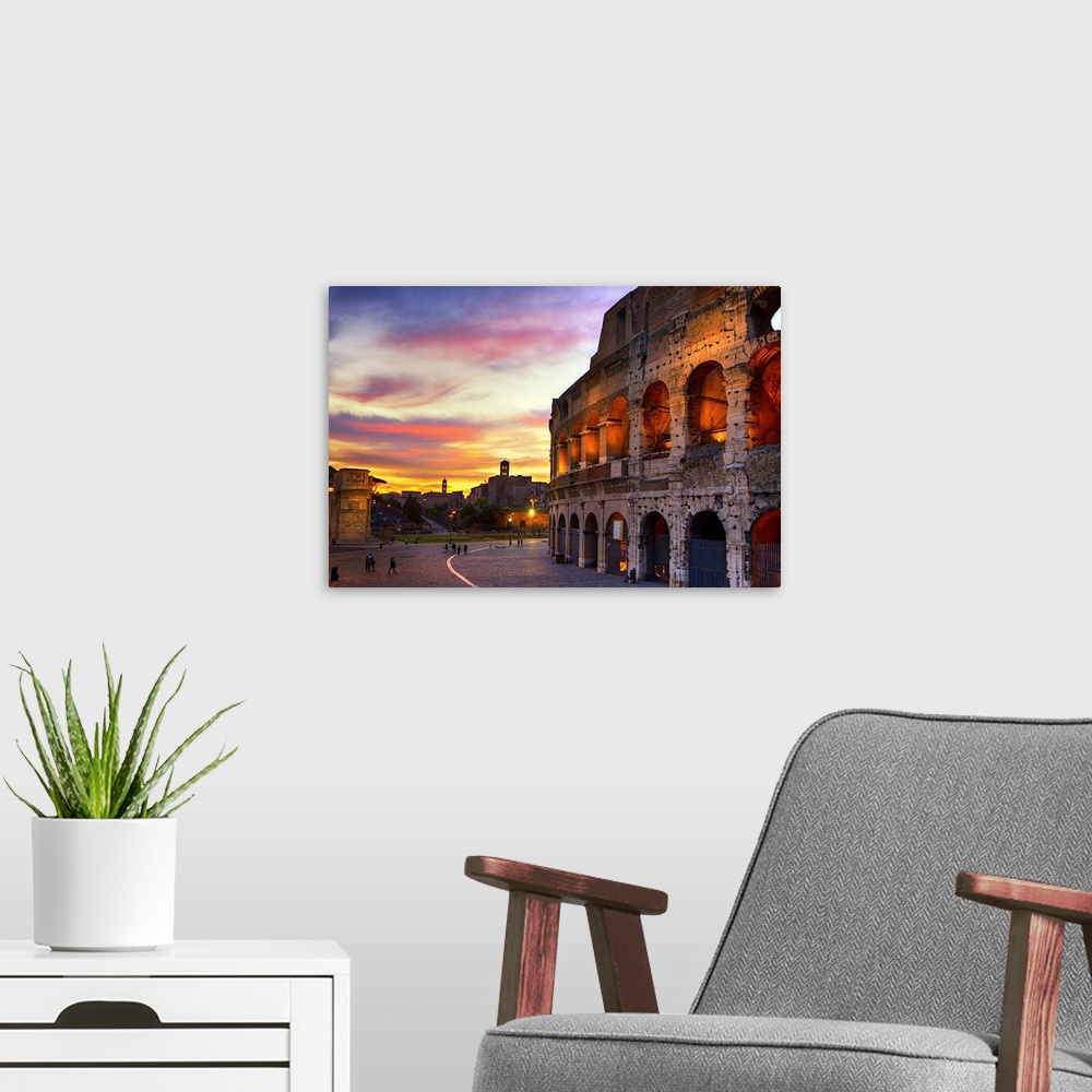 A modern room featuring Photograph of the Colosseum in Rome, Italy at sundown.
