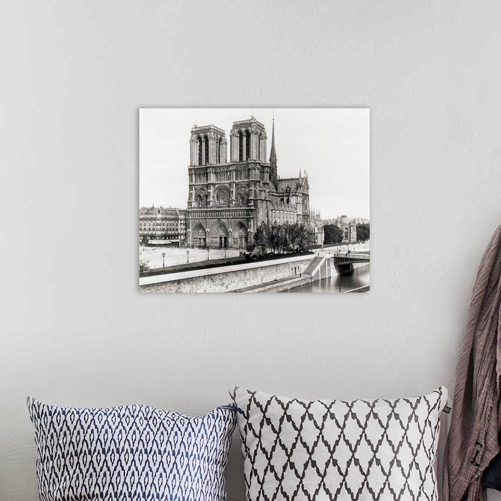 A bohemian room featuring Paris, France: Side view of Notre Dame Cathedral from the opposite bank of the Seine. Undated pho...