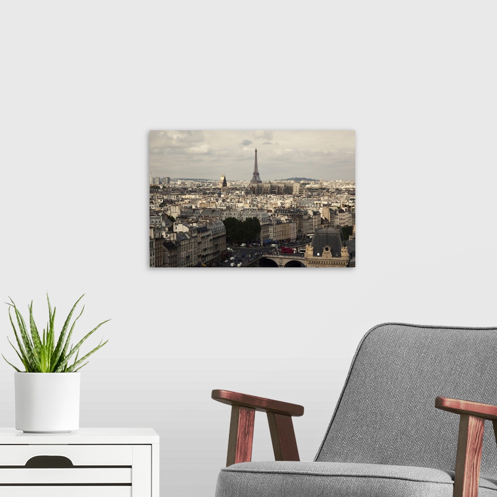 A modern room featuring Notre Dame over the Seine towards the Eiffel Tower and rooftops of the city.