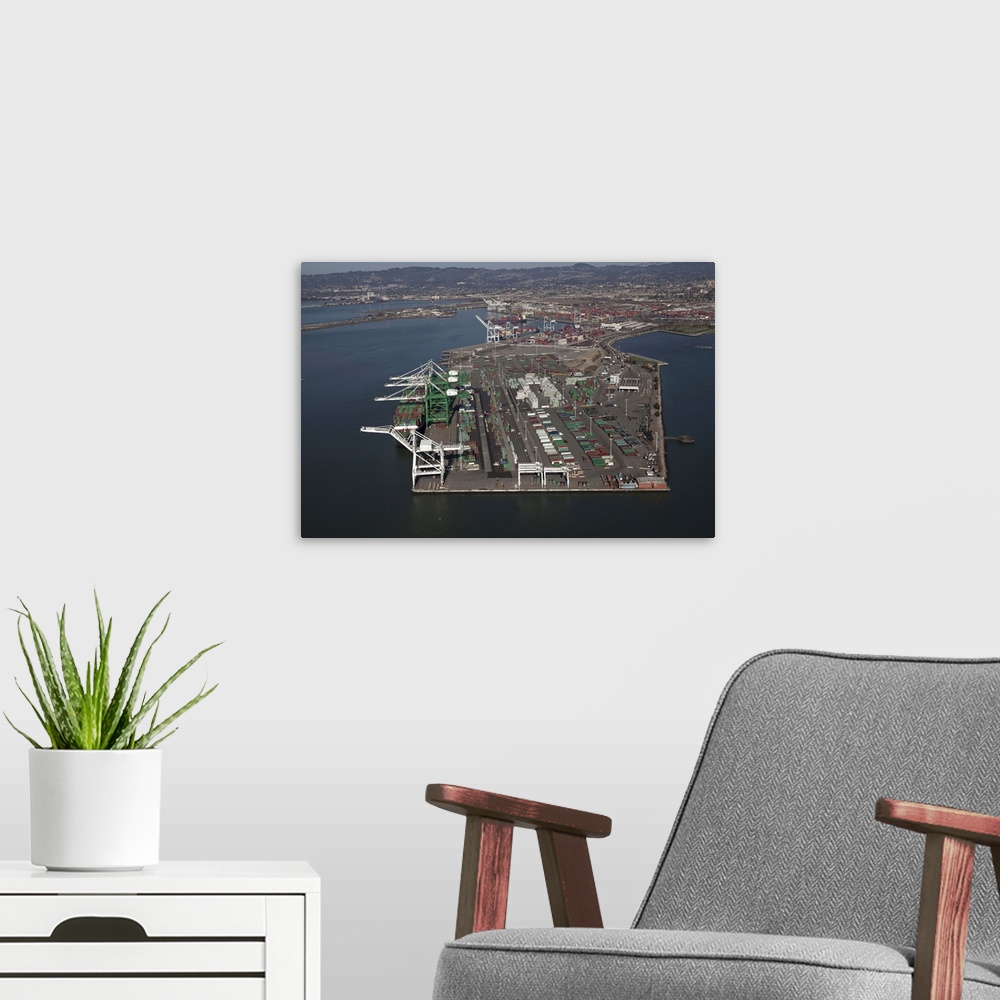 A modern room featuring Aerial image of the port of Oakland, California. The second largest container port on the West co...