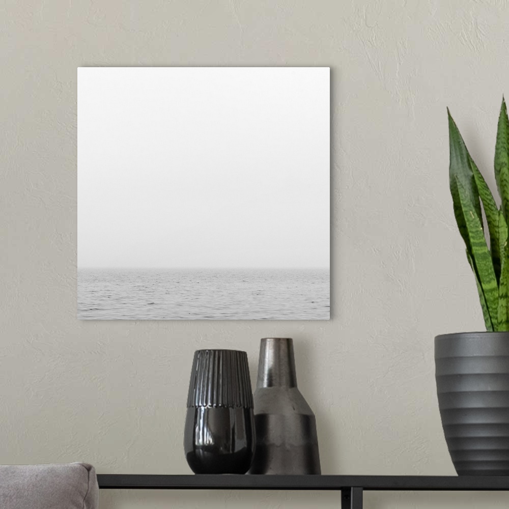 A modern room featuring Sea or ocean onfoggy day. cloudy gray sky and gray water blend together at  horizon line.
