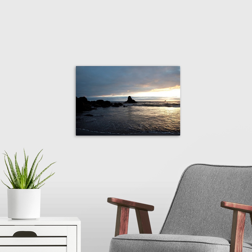 A modern room featuring Ocean sunset silhouettes lighthouse