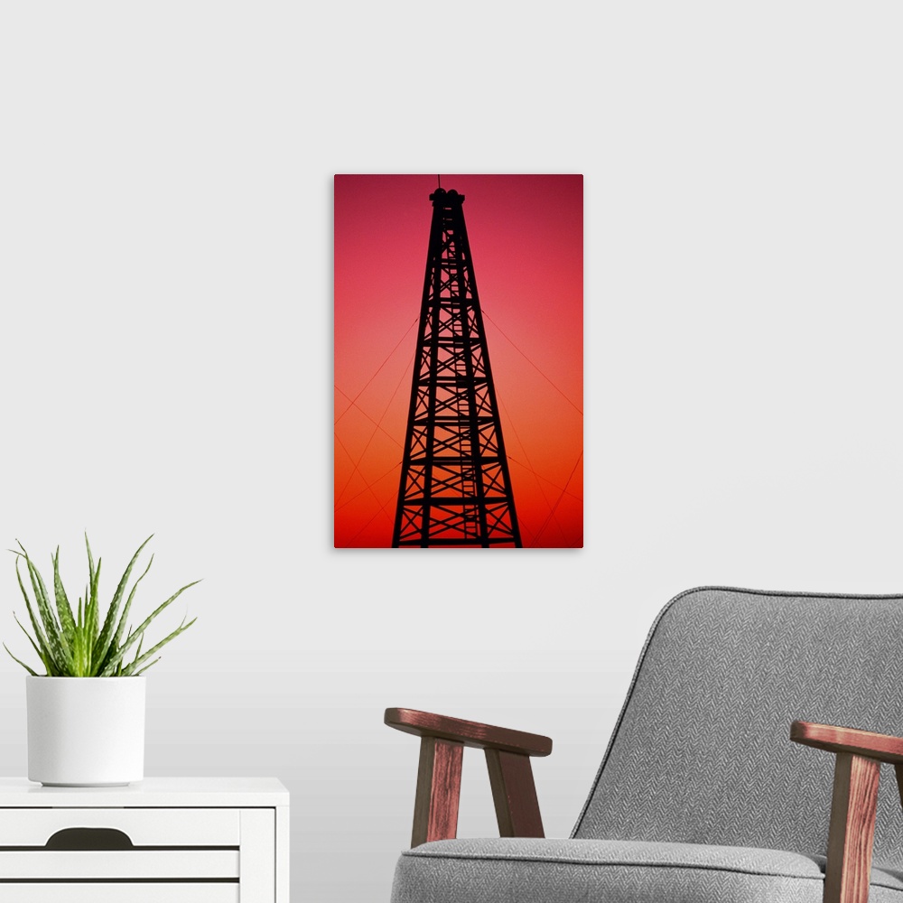 A modern room featuring Oil drilling rig at sunset
