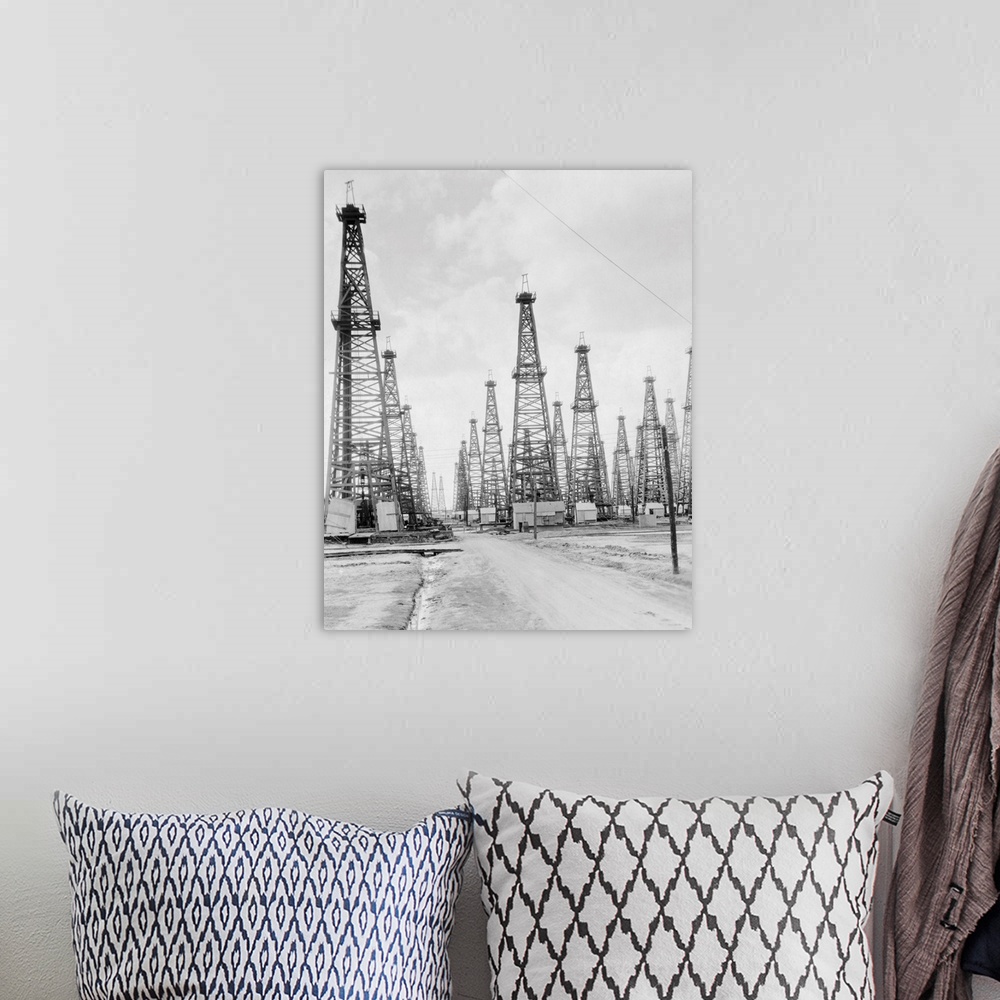 A bohemian room featuring U.S.A. Texas Beaumont spindle top oil fields.