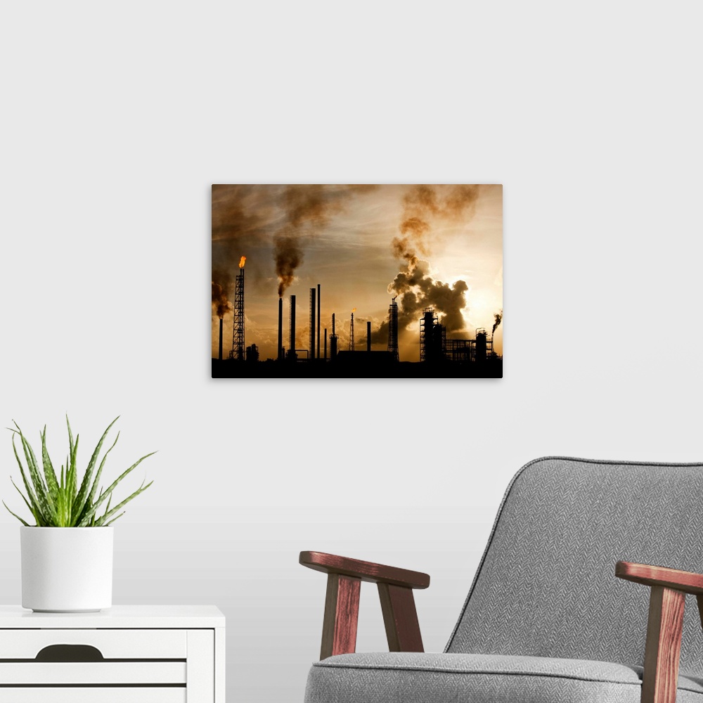 A modern room featuring Netherlands Antilles, Curacao, Flames and smoke billow from natural gas flares and smokestacks at...