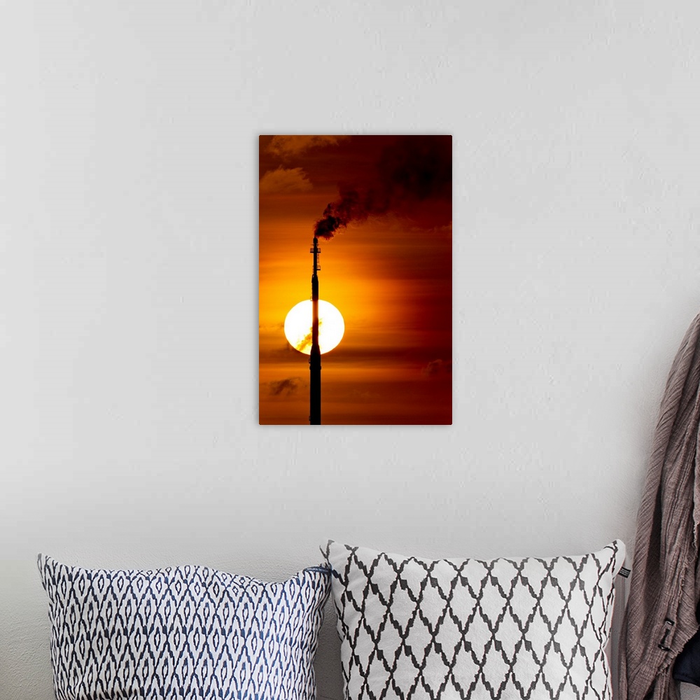 A bohemian room featuring Aruba, Flames billow from natural gas flare at Valero Oil Refinery at sunset. | Location: San Nic...