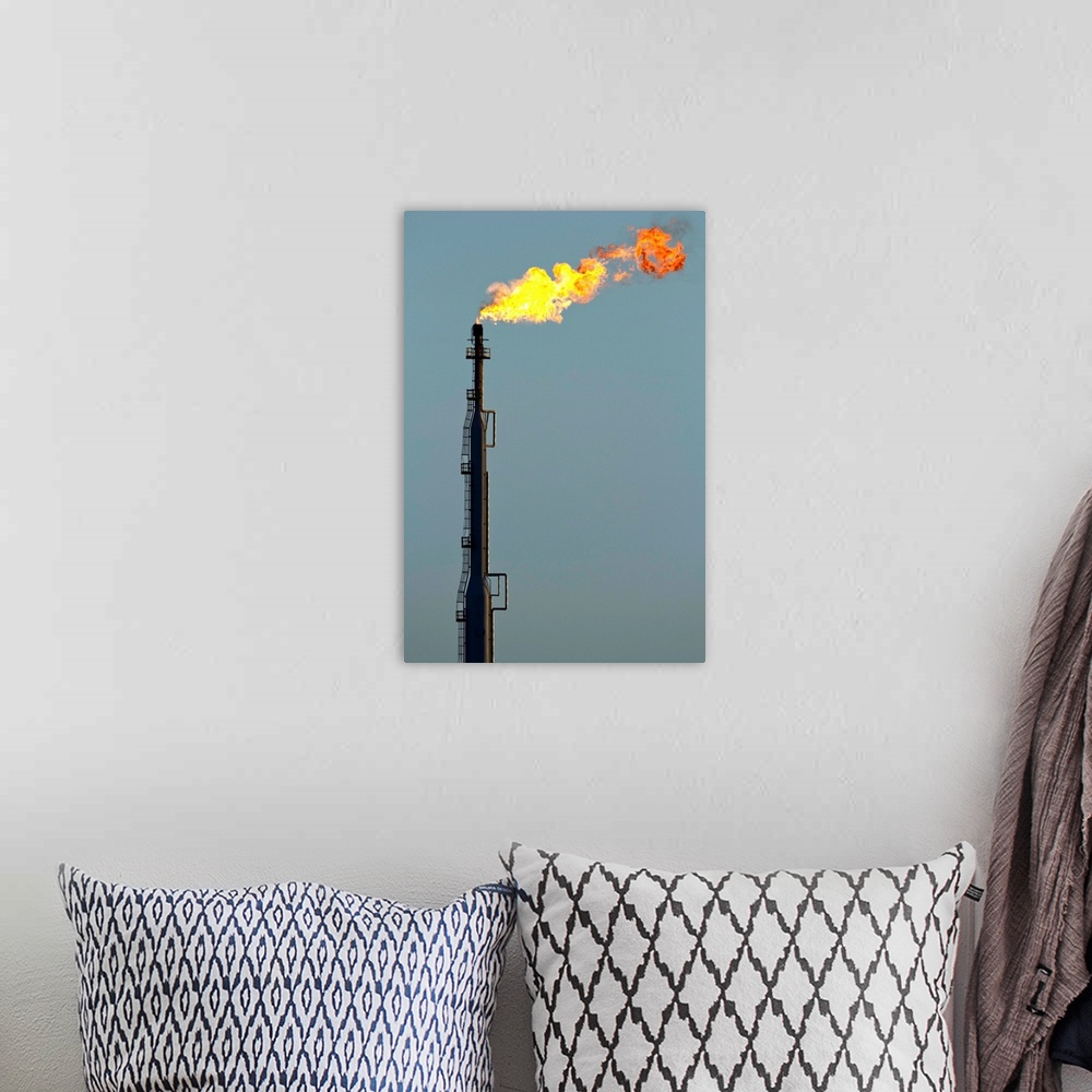 A bohemian room featuring Aruba, Flames billow from natural gas flare at Valero Oil Refinery. | Location: San Nicholas, Aruba.