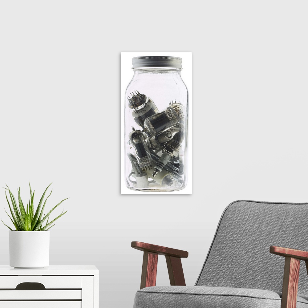A modern room featuring old-fashioned jar with spark plugs