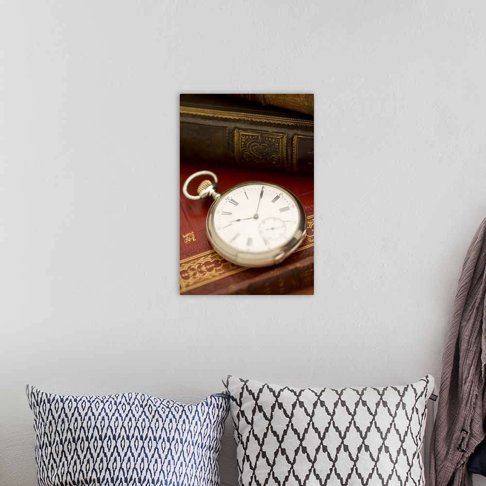 A bohemian room featuring Old-fashioned pocket watch and books