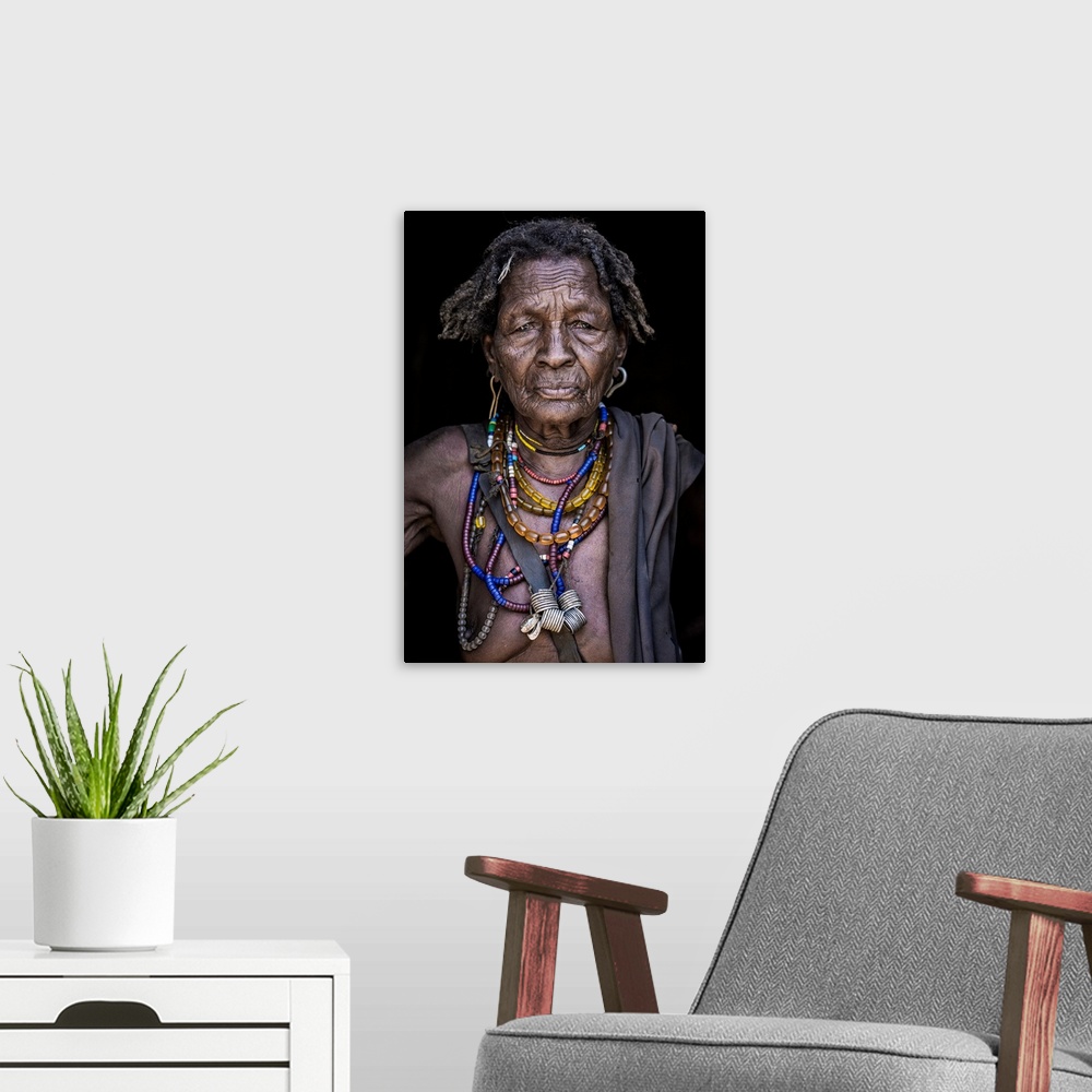 A modern room featuring March 19 2019 portrait of an old woman from arbore tribe (Africa) Omo valley, Ethiopia.